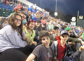 A group of teens at a baseball game during Beyond Akeela's college readiness program for neurodivergent teenagers