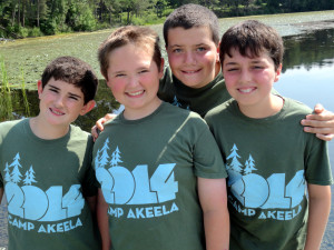 Boston Quirky Teens Campers standing in front of a lake at Camp Akeela in 2014 during their experience at a social skills summer camp for neurodiverse teens. 
